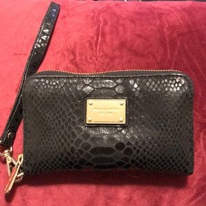 Lightly used Michael Kors black snakeskin wristlet